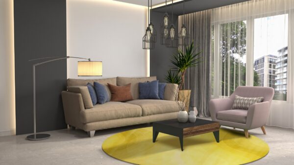 A bright yellow round rug defines a modern seating area with a beige sofa and pink accent chair.