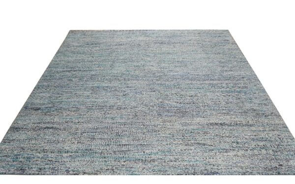 Textured gray and blue area rug with a horizontally marled abstract pattern on a white background.
