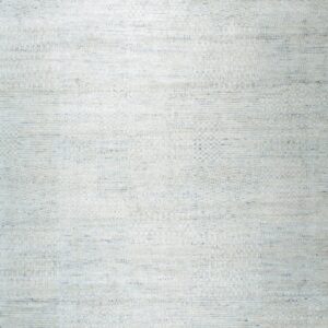 Low-pile rug featuring a complex, striated texture and geometric accents in off-white and pale blue.
