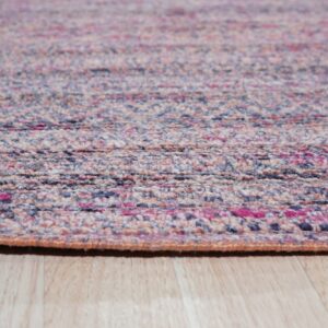 Speckled pink, blue, and beige low-pile rug with a textured weave rests on light wood planks.