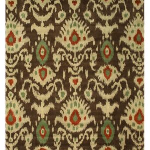 Close up of a medium-pile rug featuring a brown and cream ikat pattern accented with rust red and sage green.
