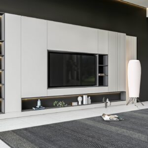 Charcoal and light gray patterned rug anchors a modern room with a large media wall and window view.