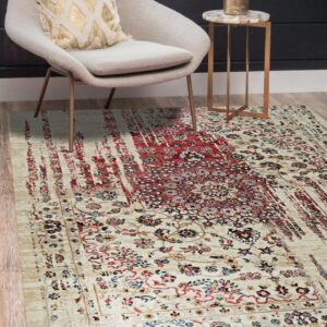 Cream and red traditional rug with a distressed stripe pattern placed beneath a modern gray chair.