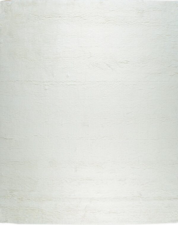 A solid off-white high pile rug displays a shaggy, uneven texture with subtle horizontal lines.