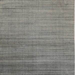 A gray rug featuring horizontal striations in varying shades of charcoal and light gray.