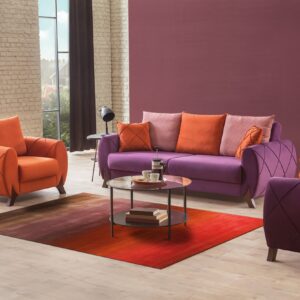 Red and brown gradient rug on light floors between purple and orange modern living room furniture.