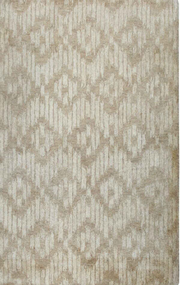 Textured rug featuring an abstract cream and beige vertical geometric pattern.