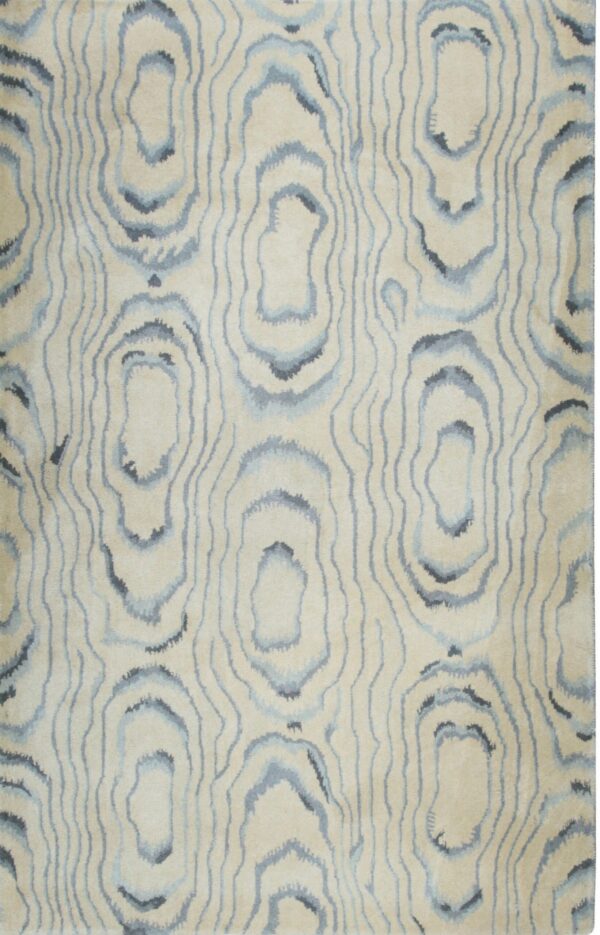 Beige rug featuring an abstract vertical pattern of concentric blue and gray lines.