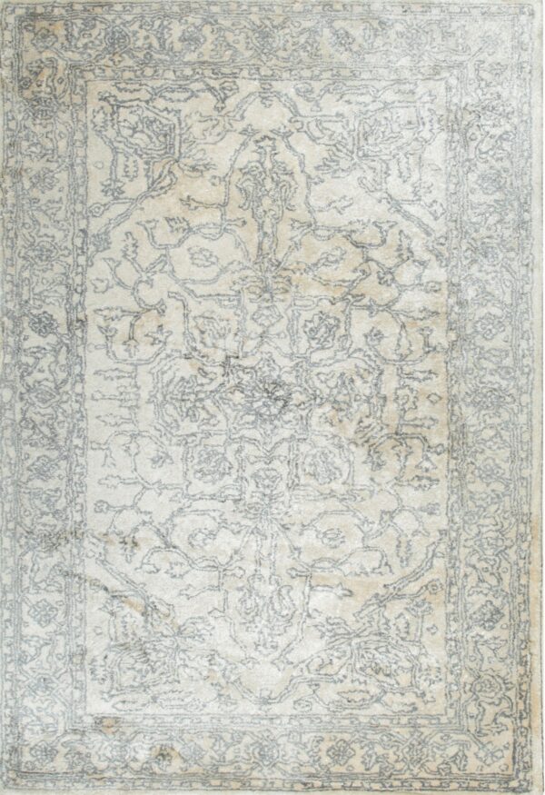 Elegant beige rug with intricate patterns.