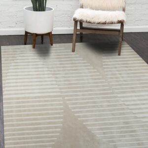 Smooth beige rug with tonal geometric dashed lines lying on a dark floor near a fuzzy white chair.