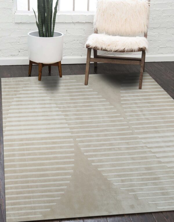 Smooth beige rug with tonal geometric dashed lines lying on a dark floor near a fuzzy white chair.