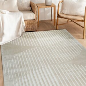 Greige rug featuring abstract white stripes in a sunlit room with wicker furniture on a wood floor.