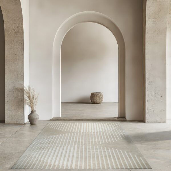 Pale beige striped runner rug in a minimalist room with large archways and textured walls.