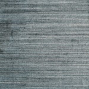 Close-up of a blue and gray heathered rug with strong horizontal striations.
