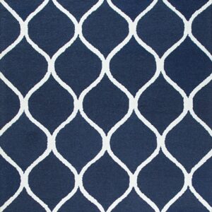 Textured navy blue rug with a contrasting white geometric ogee trellis pattern.