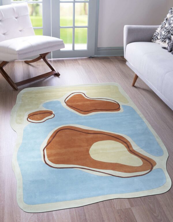 Abstract curved rug featuring blue, brown, and yellow organic shapes in a modern room with wood floors.