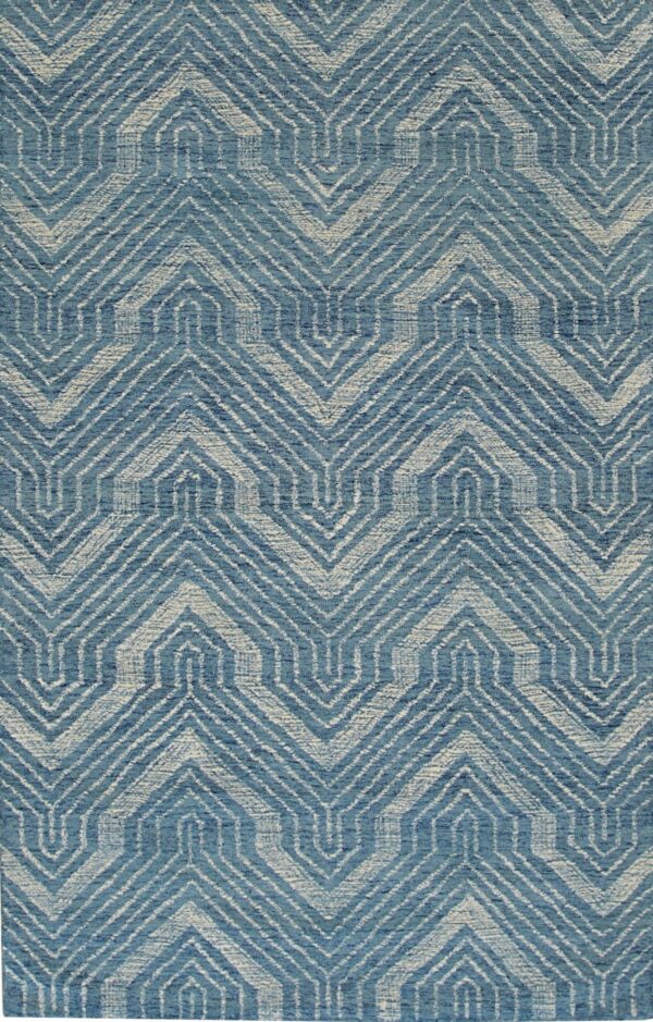 Textured blue and off-white rug featuring a repeating geometric zigzag and stepped pattern.