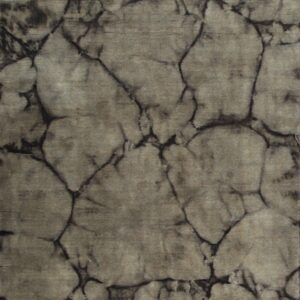 A low-pile rug features a gray-brown, mottled background defined by dark, crack-like, abstract veining.