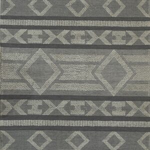 Dark gray flatweave rug with light gray textured diamond and chevron patterns, bordered by short fringes.
