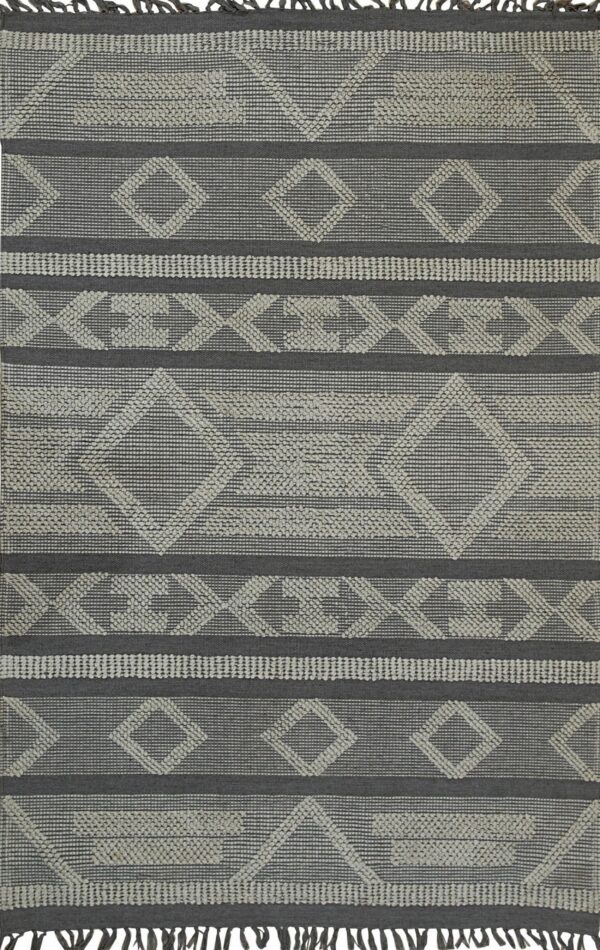 Dark gray flatweave rug with light gray textured diamond and chevron patterns, bordered by short fringes.