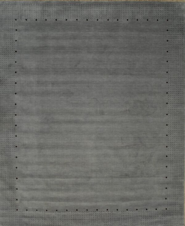 Gray rug with dotted border design.