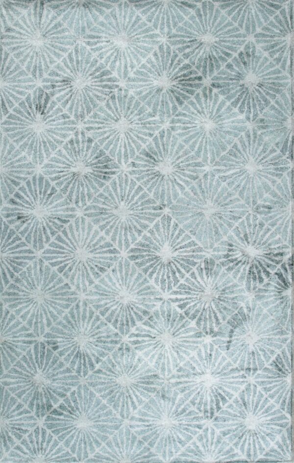 Textured, soft rug in aqua and white featuring a repeating geometric pattern of starbursts and grid lines.