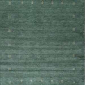Teal green rug features visible abrash and repeating tan geometric and stylized tree motifs.