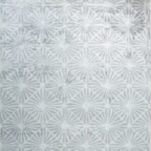 Light gray rug featuring a distressed texture and repeating white geometric sunburst motifs.