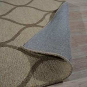 Textured beige and taupe rug with an interlocking pattern partially covers light wood flooring.