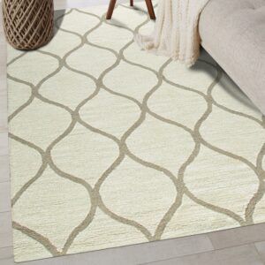 Textured cream rug with a beige ogee design sits on light gray wood flooring next to a sofa.