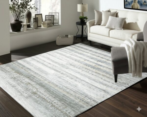 Abstract silver and white striped rug lies on dark hardwood flooring in a modern living space.