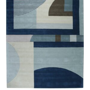 Geometric abstract rug design featuring navy, light blue, cream, and brown blocks and striped semicircles.