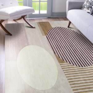 Geometric abstract rug in cream, pink, brown, and black stripes lays on wood floor with modern seating.