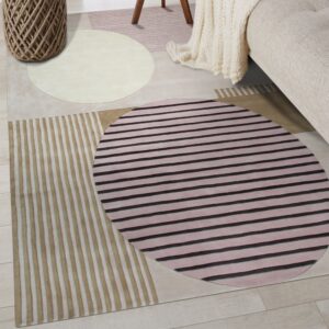 An abstract rug features stripes and circles in pink, black, tan, and cream tones on wood flooring.