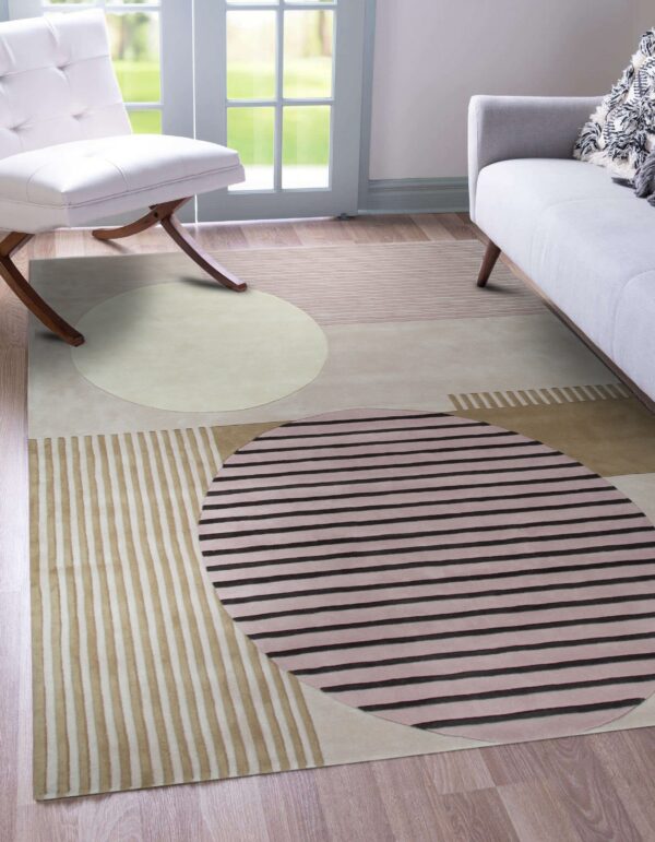Beige, taupe, and pink geometric rug with large striped circles, grounding a modern seating area.