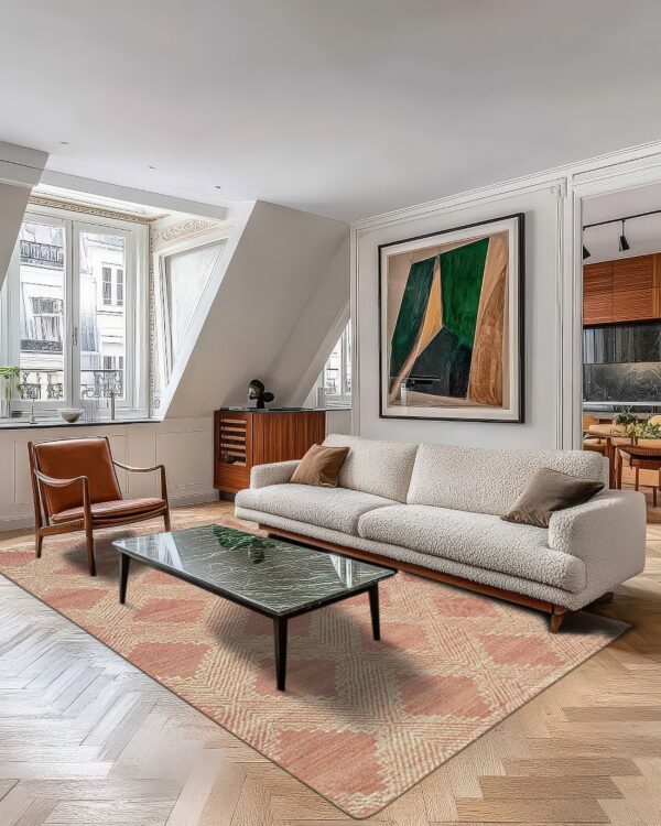 A terracotta and cream geometric rug anchors a living room with a white sofa and wood floors.