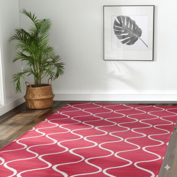Bright red runner rug with a white wavy pattern sits on dark wood flooring.