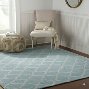 Light blue rug with a white lattice pattern sits on wood floors beneath a chair and pouf.