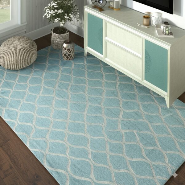 An aqua area rug featuring a light-colored ogee pattern rests on dark wood flooring.