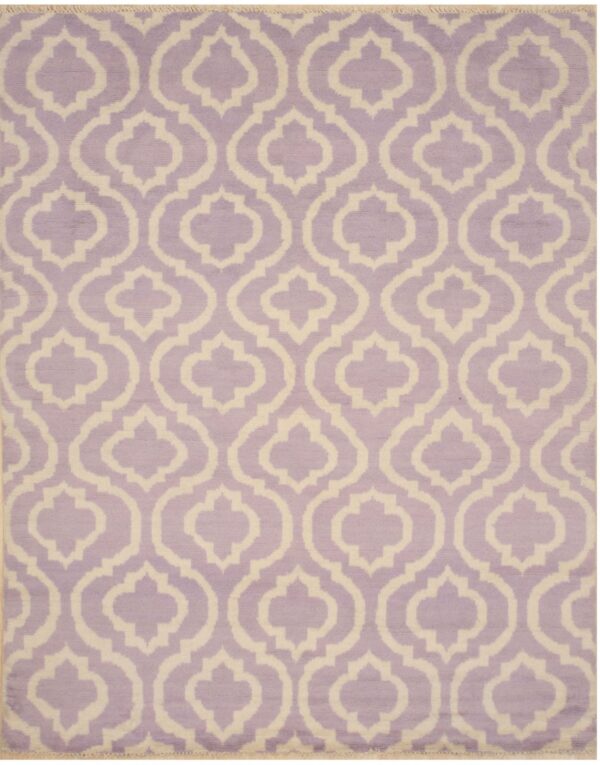 Low-pile rug in lavender and off-white with a repeating interlocking quatrefoil pattern.