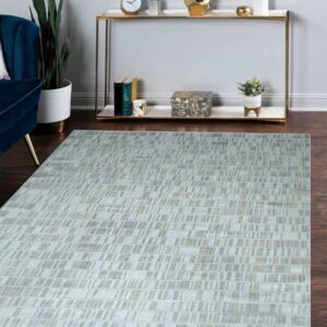 Low-pile gray and tan rug with a linear dash pattern sits on wood floors in front of a console table.