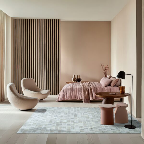 A pale blue and beige geometric pattern rug sits on light wood floors in a modern bedroom setting.