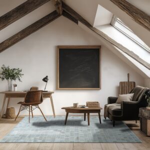 A blue and gray tiled-pattern rug anchors a light wood floor in an attic room with exposed wood beams.