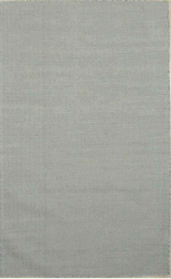 Rectangular rug with a dense blue and light gray repeating chevron or zigzag design.