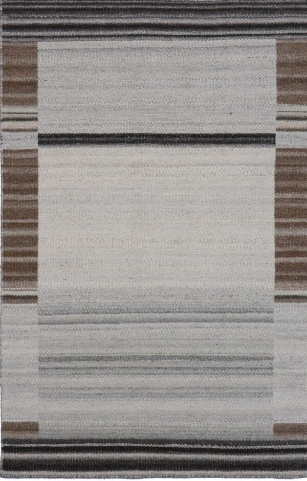 Geometric flatwoven rug featuring a light gray center bordered by brown and dark striped bands.
