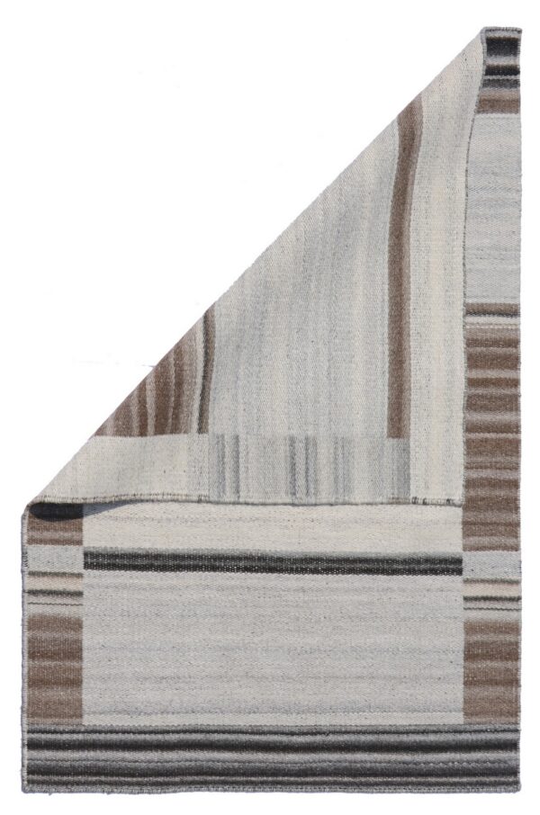 Folded flatwoven rug displaying light gray, brown, and dark gray vertical and horizontal stripes.