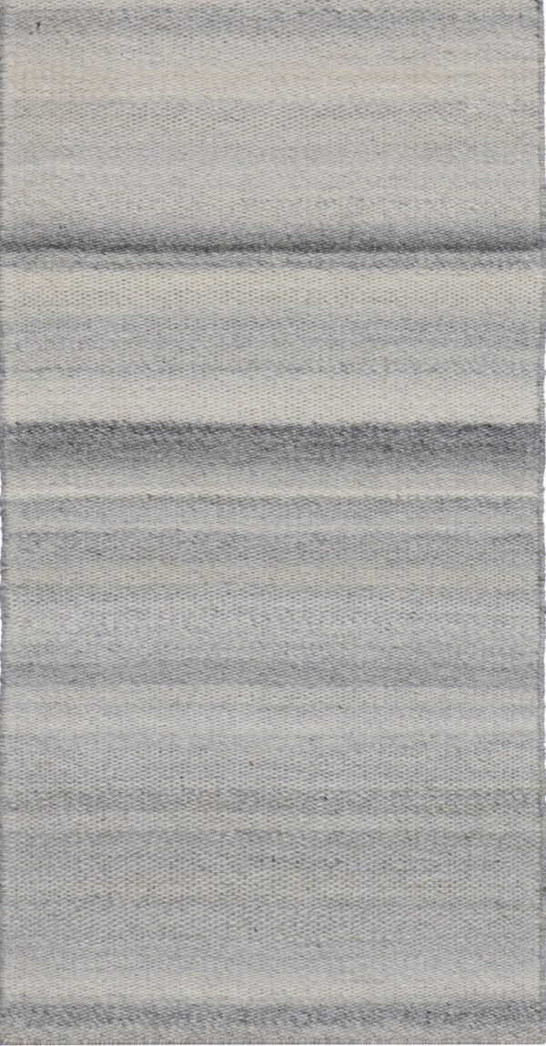 Flatweave rug displaying wide horizontal stripes ranging from white to dark gray.