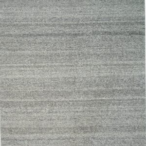 Detailed view of a low-pile rug showing a black and white woven chevron pattern.