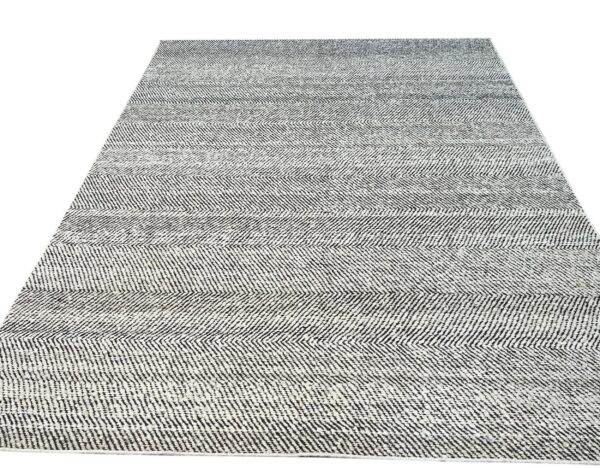 Textured black and white runner rug featuring alternating horizontal stripes with chevron weave.