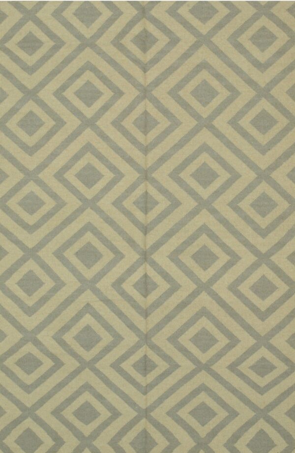Flatweave rug displaying a repeating geometric diamond pattern in pale beige and dusty blue-gray.